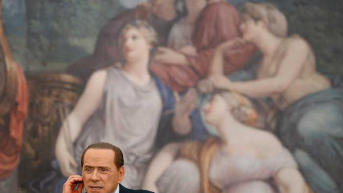 Merkel face doar cât o „vacă grasă” pentru Berlusconi