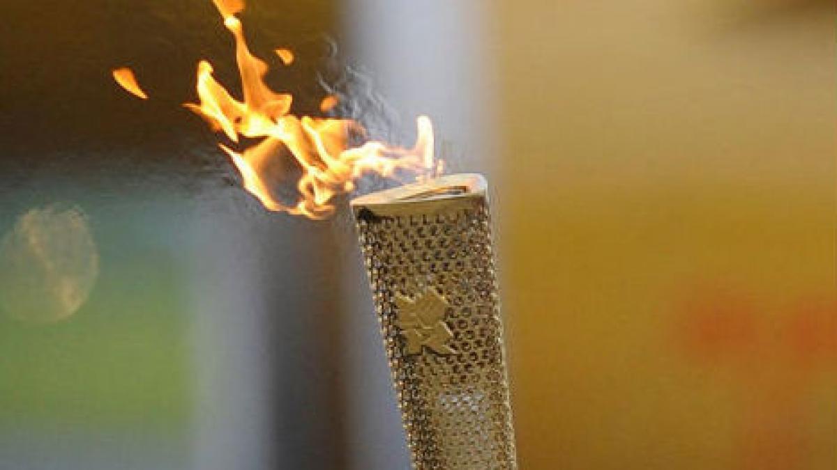 A murit în timp ce purta torţa olimpică!