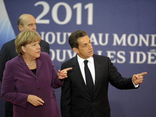 Franţa şi Germania le cer grecilor să decidă dacă mai vor sau nu în zona euro