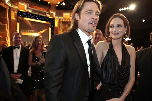 FOTO: Brad Pitt şi Angelina Jolie s-au sărutat de mai multe ori pe covorul roşu