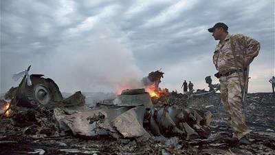Observatorii OSCE anunță că au găsit urme de perforații pe fuselajul avionului Boeing777 prăbușit în Ucraina