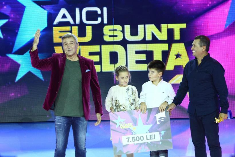Nea Mărin și nepoții săi, Darius și Ana, au câștigat  cea de-a doua ediție a show-ului “Aici eu sunt vedeta”