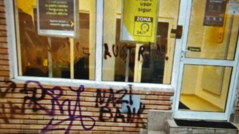 Raiffeisen Cluj, vandalizată după ce Austria a respins intrarea României în Schengen: „Nazi bank”