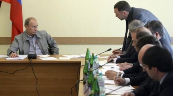 putin umileste un oligarh