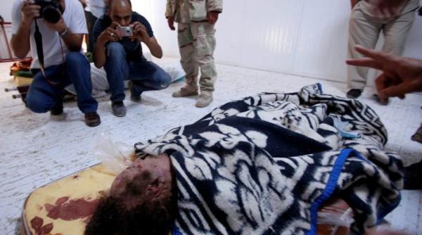 muammar gaddafi inmormantat intr un loc secret din desert