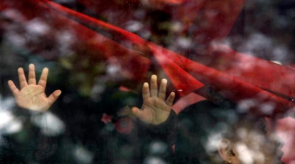 romanii care muncesc in marea britanie sunt exploatati traiesc in conditii inumane si sunt victime ale rasismului si amenintarilor