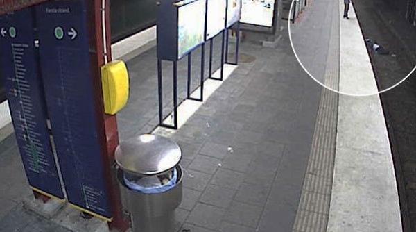 imaginile care au scandalizat suedia un hot isi buzunareste victima pe care o abandoneaza pe sinele de tren