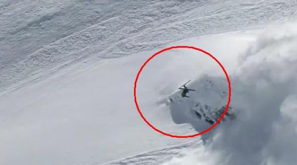 curaj nebun cu avalansa pe urmele lui un schior reuseste un salt superb