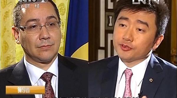 premierii victor ponta si emil boc intr un video reportaj pe postul national din china