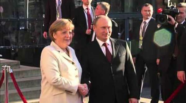 putin i a asigurat pe merkel si hollande ca va respecta alegerea poporului ucrainean