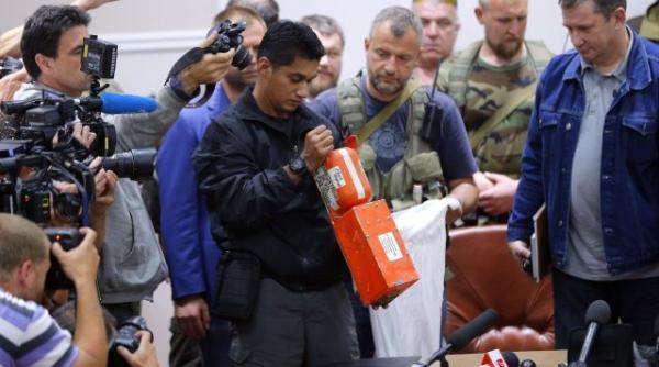 cutiile negre ale zborului mh17 examinate de organizatia internationala a aviatiei civile concluziile anchetatorilor olandezi