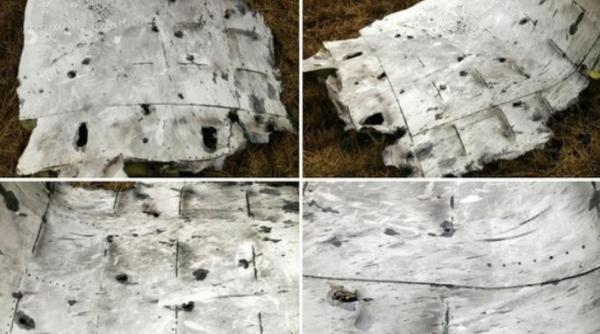 de ce s a prabusit avionul malaysia airlines indicii in fotografiile facute epavei de doi reporteri new york times