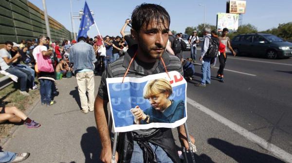 angela merkel germania poate prelua refugiatii fara a creste taxele