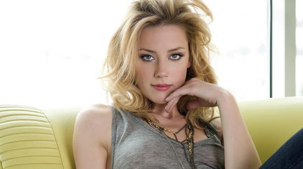 amber heard sustine ca va dona banii obtinuti in urma divortului de johnny depp