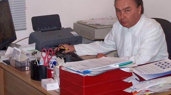 medic talharit si batut in propria casa