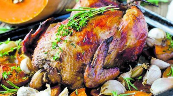 reteta zilei pui la cuptor cu usturoi si lamaie