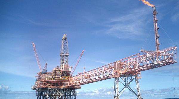 exxon anunta reducerea semnificativa a investitiilor in acest an