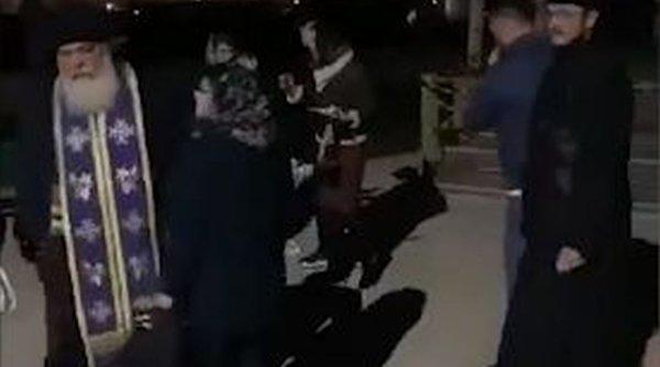 celebrul preot calistrat pune la pamant o femei in curtea bisericii politia ancheteaza incidentul