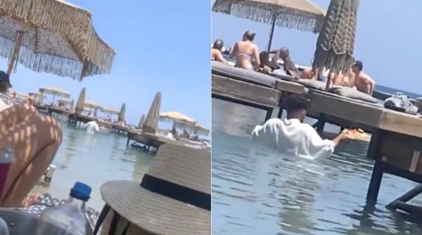 imagini socante scandal grecia ospatar serveste clientii apa piept