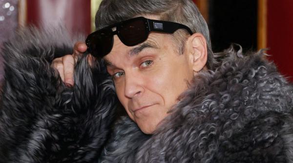 Robbie Williams face istorie. Noul album depășește Beatles în topurile din Marea Britanie