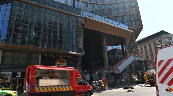 Anunț MAE: Un român a murit în incendiul din Bruxelles, iar un altul este grav rănit. Șase muncitori au murit după prăbușirea unui lift în clădirea OXY
