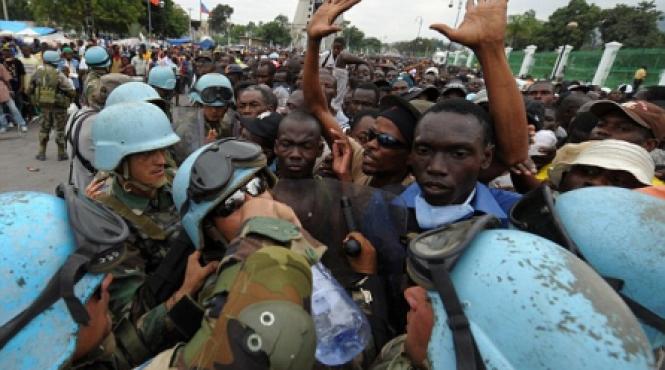 mii de haitieni flamanzi au devastat un depozit al onu