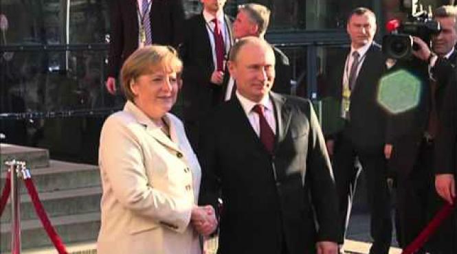 putin i a asigurat pe merkel si hollande ca va respecta alegerea poporului ucrainean