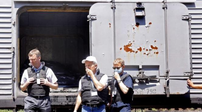 legistii olandezi au examinat trupurile victimelor zborului mh17 intr o gara primele concluzii ale expertilor