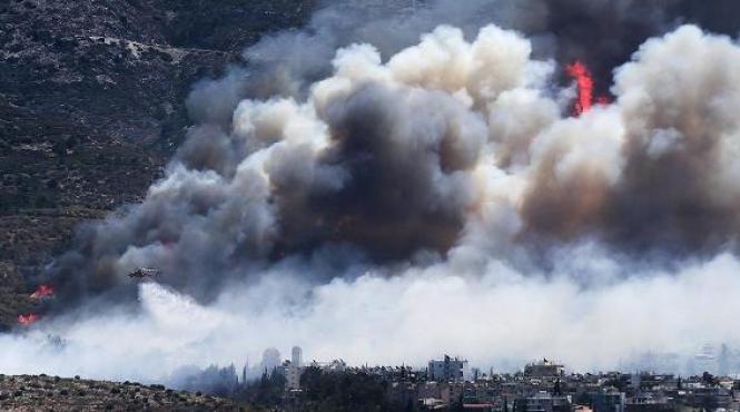 politia din atena a arestat doi barbati suspectati pentru declansarea incendiilor de vineri