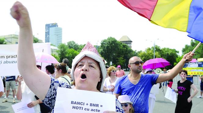 lovitura pentru romanii cu credite in franci guvernul a atacat legea conversiei