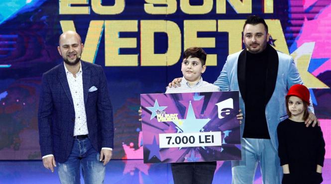 liviu guta si copiii sai mario si maria au donat cei 7 000 de lei castigati la aici eu sunt vedeta unui baietel grav bolnav