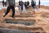 Plaja din Tripoli a ajuns cimitir pentru victimele lui Gadafi 18422701